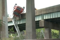The snooper truck that killed a bridge inspector in Connecticut hangs over the Interstate 84 on-ramp. (Screenshot from NBC Connecticut)