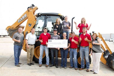 Students and staff of Southeastern Community College surround the new CASE backhoe