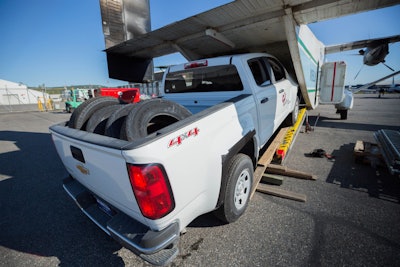 A 2015 Chevrolet Colorado rolls into a Shorts 330 Sherpa airplane on its way to ASRC Energy Services employees in a remote area of Alaska.
