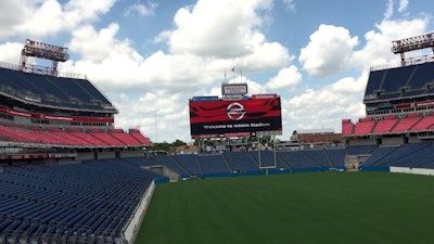 NASHVILLE, Tenn. (August 18, 2015)  This might just be the perfect tailgating spot for this weekends upcoming Tennessee Titans preseason game against the St. Louis Rams. Nissan enlisted a heavy-duty crane to lift an all-new 2016 Nissan TITAN XD full-size pickup into a special reserved parking space next to the video scoreboard at the newly named Nissan Stadium in downtown Nashville, Tenn.