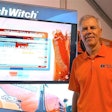 Dennis Wierzbicki, Ditch Witch president, in front of an HDD Advisor display, the company’s web-based tool being showcased at ICUEE.