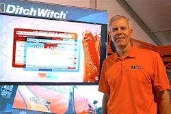 Dennis Wierzbicki, Ditch Witch president, in front of an HDD Advisor display, the company’s web-based tool being showcased at ICUEE.
