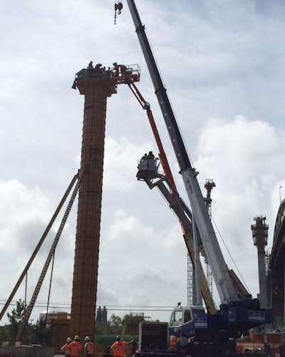 Firefighters come to the aid of a construction worker who passed out atop a pillar on the Kosciusko Bridge. Photo Credit: FDNY
