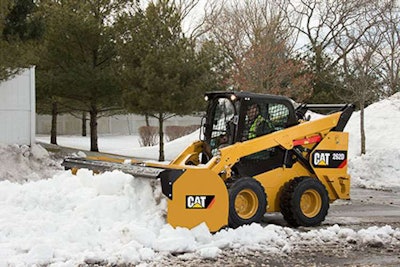 Cat 262D skid steer with equipped with a straight snow push.