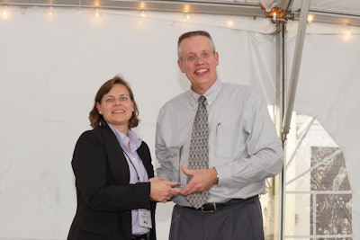Julie M. Vandenbossche (left) receives ACPA’s Marlin J. Knutson Award for Technical Achievement from association President and CE0 Jerry Voigt.