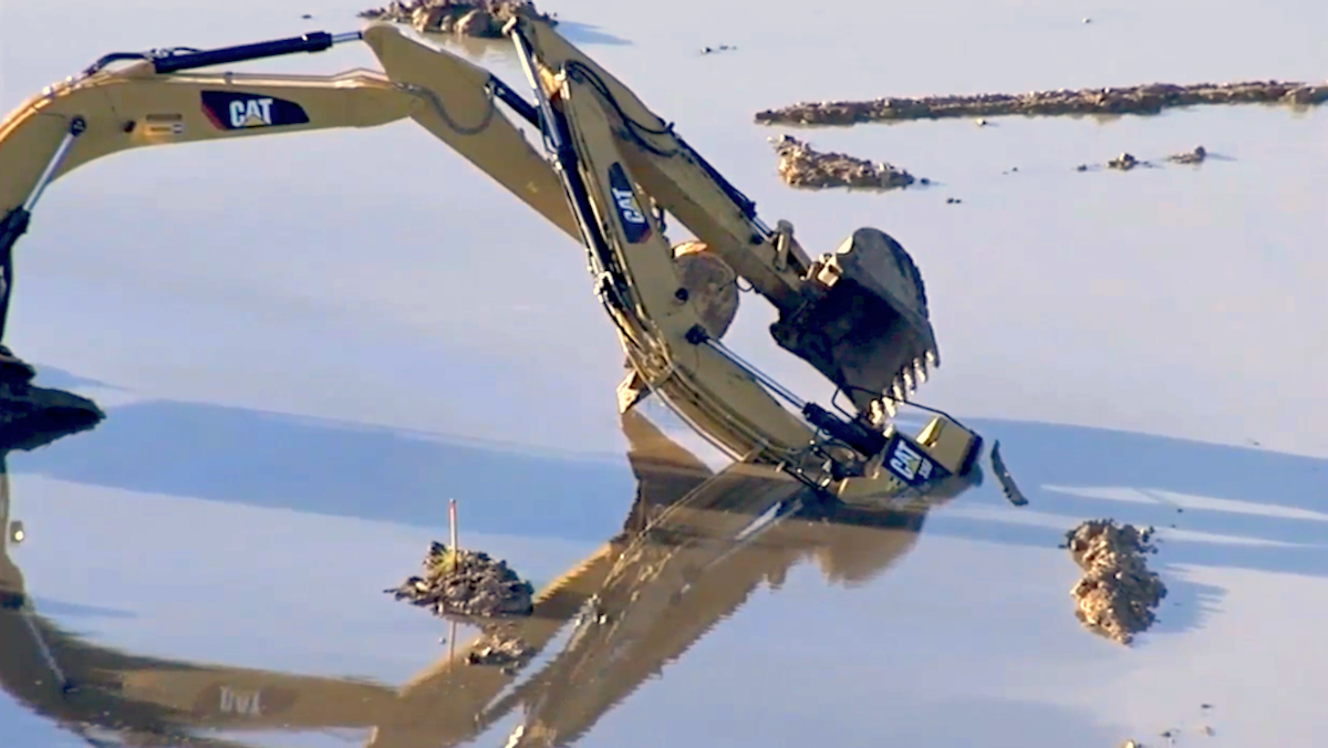 excavator-operator-killed-after-machine-becomes-submerged-in-pond-on