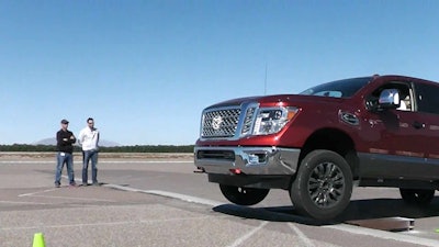 Titan XD slams into a curb and catches air. The truck was put through several durability tests this past week at Nissan’s testing facility in Arizona.