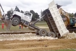 Excavators upright end dump