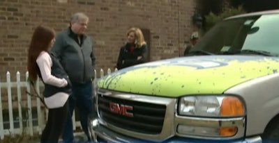 Nineteen-year-old Charlotte Heffelmire, shown here to the left of her father, is credited for saving her dad’s life after she lifted this GMC truck off of him during a botched repair job that set the family’s Virginia home on fire.