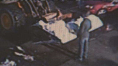 Security camera footage of Succar standing in front of the snow plow
