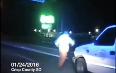 Screen shot of the GDOT worker running to get out of the way of a semi-truck