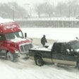 Time Warner Cable News in Rochester, N.Y. videoed a good Samaritan using his pickup to pull a semi from the snow this week.
