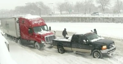 Time Warner Cable News in Rochester, N.Y. videoed a good Samaritan using his pickup to pull a semi from the snow this week.