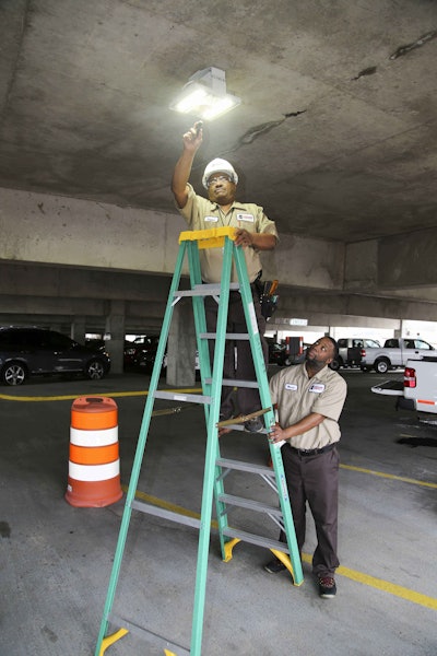 A Mississippi Department of Transportation facilities maintenance crew replaces bulbs in motion-sensitive lighting fixtures at an MDOT facility.