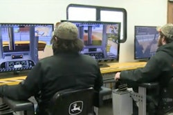 Students work with Deere equipment simulators in Mason City, Ia. Photo credit: KIMT TV footage