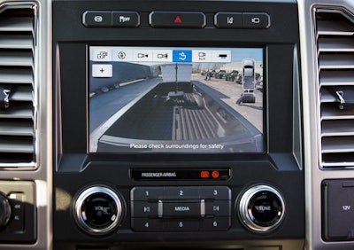 A center high-mounted stop lamp camera provides visibility into the cargo box with a Ford-first dynamic guideline.