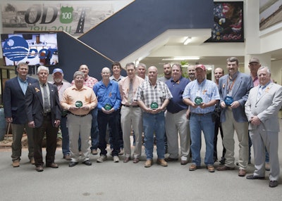 Oklahoma DOT field divisions and crews were recognized for good safety records at a recent meeting of the Oklahoma Transportation Commission. They wore orange ribbons in honor of the 59 ODOT workers who have died in the line of duty and to remind everyone to practice safe driving in highway work zones. Back row, from left: Division 7 Engineer Jay Earp, Gray County Maintenance Superintendent Rick Davis, Data Collection Branch Manager Aaron Fridrich, Division 4 Construction Engineer Joe Echelle, Oklahoma City Residency Transportation Manager Andy Wilson, Division 3 Bridge Crew Superintendent Dustin Grand, Division 3 Engineer Kevin Bloss, Division 1 Engineer Darren Saliba and Checotah Interstate Maintenance Superintendent Sam Duvall. Front row, from left: Division 5 Engineer Brent Almquist, Blaine County Maintenance Superintendent Mark Wray, Division 6 Shop Superintendent Bruce Appleton, Division 6 Engineer Ron McDaniel, Ottawa County Maintenance Superintendent Dustin Marang, Division 8 Engineer Randle White, Division 2 Division Wide Maintenance Superintendent Roddy Mills, Division 2 Engineer Anthony Echelle and ODOT Safety Branch Manager Mike Bracken.