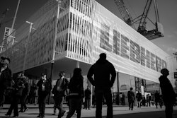 Bauma attendees walk past Liebherr’s booth at the 2016 show.