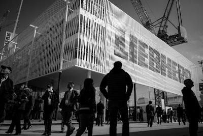 Bauma attendees walk past Liebherr’s booth at the 2016 show.