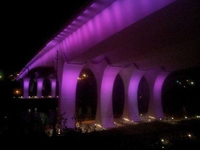 I-35W bridge bathed in purple light (MnDOT)