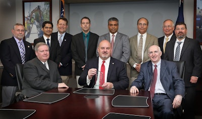 VDOT was named DBIA Transportation Owner of the Year. Seated (l-r): Chief Engineer Garrett Moore, PE, Commissioner Charlie Kilpatrick, PE, Deputy Chief Engineer Mohammad Mirshahi, PE. Standing: members of VDOT’s Alternate Project Delivery Team, Stephen Kindy, PE, Suril Shah, EIT, Bryan Stevenson, PE, Jeffrey Roby, PE, DBIA, Shailendra Patel, PE, DBIA, John Daoulas, PE, Jeff Hetzer, Joseph Clarke, PE, DBIA