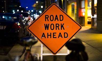 Road work ahead construction sign