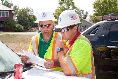 A Virginia DOT Engineer Robert Marshall, left, and Alpha Corporation Construction Inspector Joshua Hays discuss a bridge superstructure replacement. Virginia DOT