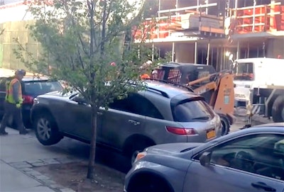 Skid steer lifting car NYC
