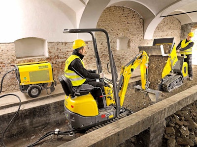 Wacker Neuson’s dual-power 803e excavator and electric DT10e dumper working on an indoor demolition job.