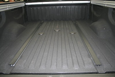 A gooseneck hitch and tie-down rails on either side of the bed make the Titan XD ready for work.