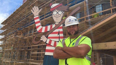 Haney with his 8-foot-tall , plywood Waldo. Photo Credit: Where’s Waldo Memorial Children’s Hospital Facebook group