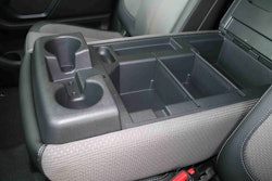 The fold-down armrest in the 2017 Titan XD Standard Cab offers two more drink holders for a total of eight. Also, notice the removable dividers inside the storage compartment. Nice!