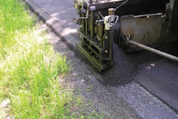 A wedge-shaped shoe acting as a screed attachment forms what is known as a Safety Edge, a 30-degree bevel that makes it easier for vehicles to return to the roadway in the event of an accident. Photo credit: FHWA