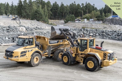 Volvo’s retrofitted autonomous L120E wheel loader loading up the also retrofitted autonomous A25F articulated hauler.