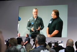 Head of FCA parts and service, Pietro Gorlier, on left, talks with “Graveyard Cars” star Mark Worman about FCA’s new HEMI engines.