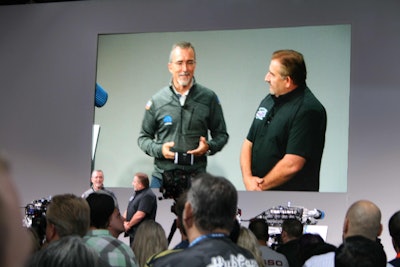 Head of FCA parts and service, Pietro Gorlier, on left, talks with “Graveyard Cars” star Mark Worman about FCA’s new HEMI engines.