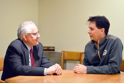 Incoming WisDOT Secretary Dave Ross, left, speaks with Wisconsin Gov. Scott Walker.