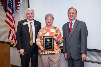 NCDOT Roadside Environmental Engineer Pat Mansfield (center), with Ned Curran (left), chairman of the North Carolina Board of Transportation, and NCDOT Secretary Nick Tennyson.
