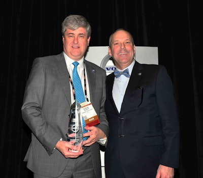 Jeff Lester (right), senior vice president of sales for Volvo Trucks North America, presents Steve Bassett, General Truck Sales dealer principal, the award for the 2016 Volvo Trucks North American Dealer of the Year.