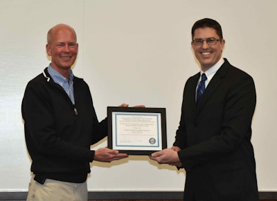 Mike Pack, left, president and COO of Cashman Equipment, receiving the company’s SHARP Award from Todd Schultz, chief administrative officer for the Nevada Division of Industrial Relations’ Safety Consultation and Training Section.