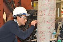 Student Peng Zhang traces cracks in the column during a strength test in UBC Okanagan’s Applied Laboratory for Advanced Materials and Structures. Photo credit: UBC Okanagan.