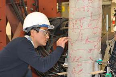 Student Peng Zhang traces cracks in the column during a strength test in UBC Okanagan’s Applied Laboratory for Advanced Materials and Structures. Photo credit: UBC Okanagan.