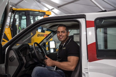 Jose Humberto Avila in the remanufactured truck he won from IronDirect at ConExpo.