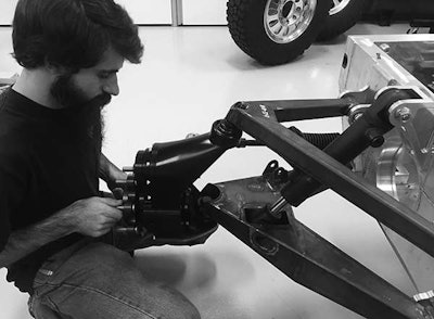 A Bollinger employee working on the company’s all-electric medium-duty truck. (Image from bollingermotors.com.)