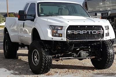 A Ford Super Duty pickup converted by F250R into a SuperRaptor riding on 40-inch tires.