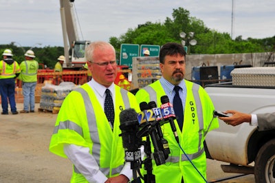 GDOT Commissioner Russell McMurry (left) and Director of Construction Marc Mastronardi announce the I-85 rebuild project will open prior to Memorial Day weekend. (GDOT)