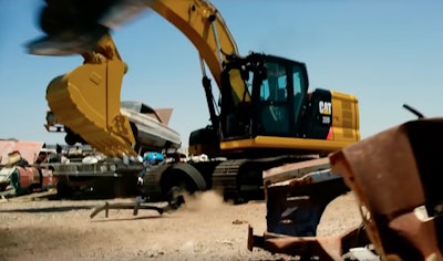 We catch a glimpse of a Cat 320 just before the giant foot of a Transformer T-Rex (yep) pounds the ground.