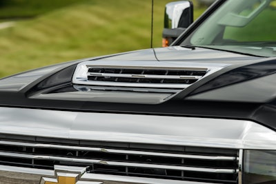 The functional hood scoop on Chevy’s latest HD trucks took GM engineers two years to develop and is seen as a key complement to the new 6.6L Duramax.