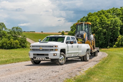 2017 Silverado 3500 with a Deere 310L backhoe in tow.