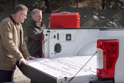 It’s back…Chevy Chief Engineer Eric Stanczak stands next to Chevy spokesman and retired NFL great Howie Long as he prepares to perform a puncture test on the aluminum bed of a 2017 Ford F-350 Super Duty pickup.
